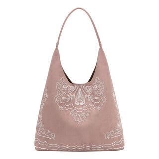 A dusty pink suede hobo shoulder bag with white embroidered paisley and border patterns.