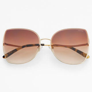Oversized square sunglasses with a gold metal frame, brown gradient lenses, and tortoiseshell temples.
