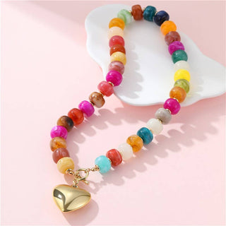 Colorful beaded necklace with a gold heart charm.