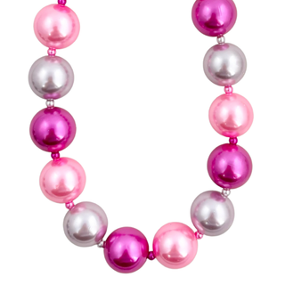 A necklace of glossy decorative glass pearls in pink shades and metallic silver.