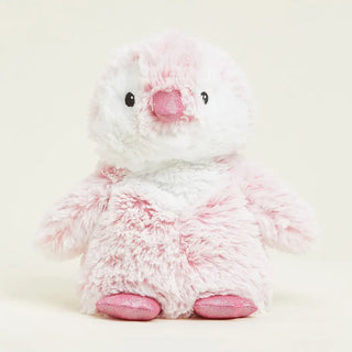 A fluffy plush penguin warmie in white and light pink.