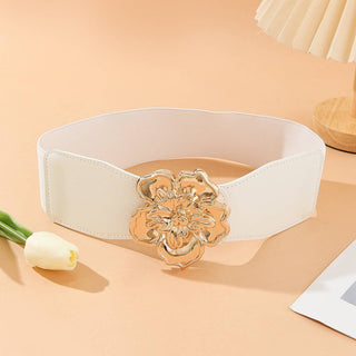 White belt with a gold flower buckle.