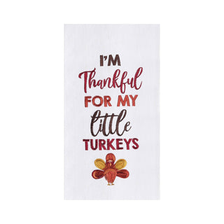 A white kitchen towel featuring the text 'I'M Thankful FOR MY little TURKEYS' in red and brown lettering, with a small embroidered-style turkey at the bottom.
