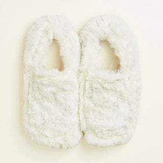 Pair of white fluffy warmie slippers.