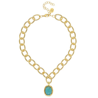 Gold chain necklace with a turquoise pendant by Susan Shaw.