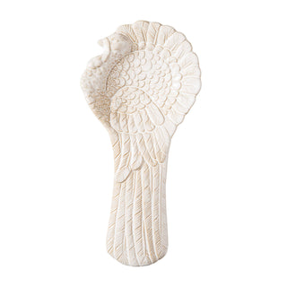 Decorative white turkey spoon rest with intricate detail.