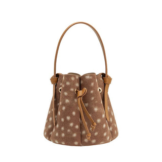 A brown recycled vegan suede bucket bag with white spots, tan leather trim, and a single top handle.