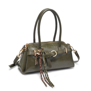 Green handbag with decorative keychain 