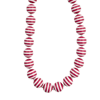 A candy cane colored beaded necklace made of glossy round beads with alternating red and white horizontal stripes. 