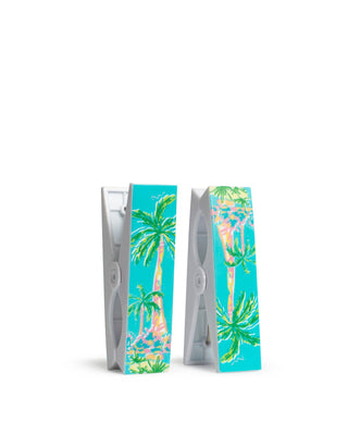 Towel pins with tropical palm tree design.