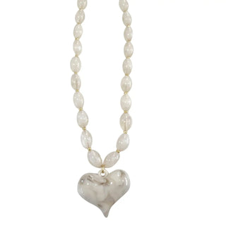 Cream beaded necklace with heart-shaped pendant 