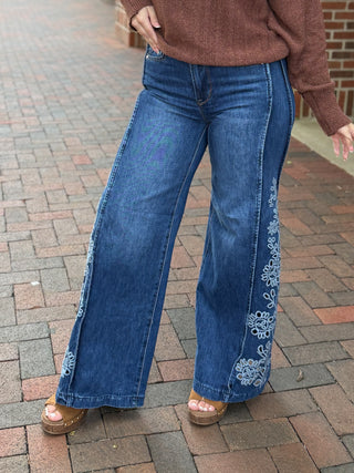  Saige Bethany High Rise Wide Leg Jeans are a medium wash wide-leg denim with a high rise,  crochet  open floral detail 