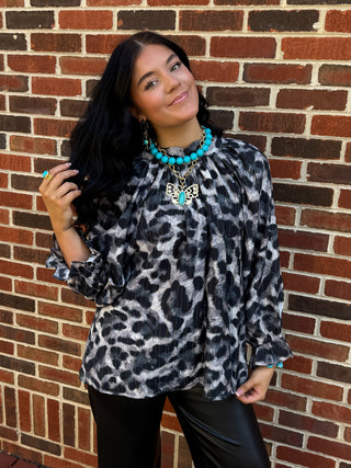 leopard print blouse with metallic gold stripe detail and ruffle cuff sleeves