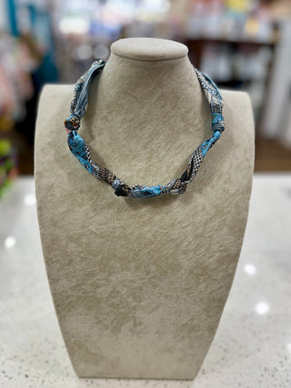 a scarf necklace that you can add charms to.