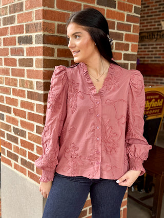 Buttoned blouse with floral embroidery detail, raised textured vine, long puff sleeves with smocked cuffs