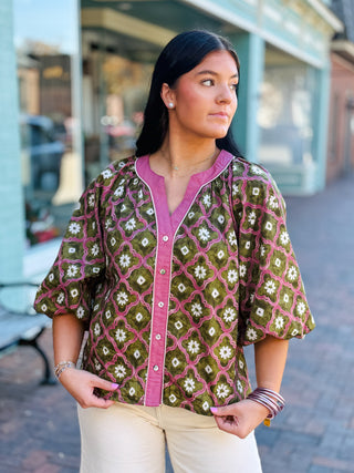 Blouse with a geometric floral print with long puff sleeves and a V-neckline