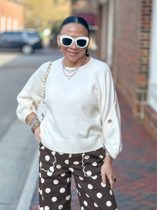 Sweater, featuring flowing three-quarter poncho sleeves and button detailing