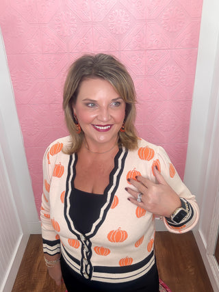 the great pumpkin sweater, pale orange sweater, black stripe, bright orange pumpkins, cardigan, buttons down cardigan, fall, thanksgiving