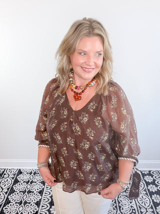 brown floral blouse