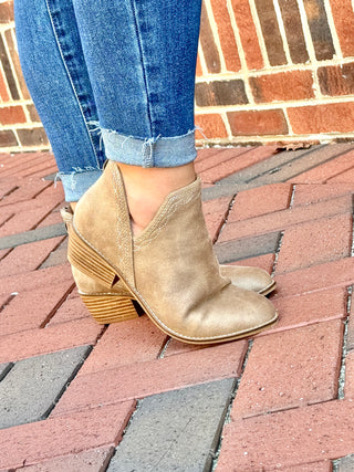 Corky tan ankle boot with white embroidery around trim with slit on side and back zipper
