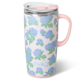 Travel mug with blue floral pattern and pink handle.