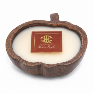 Pumpkin-shaped candle with a pumpkin vanilla scent.