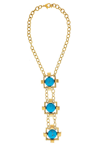 Gold necklace with blue stones.