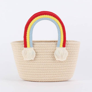 Woven bag with rainbow handles.