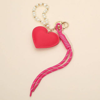 Pink heart-shaped keychain with a pink strap 