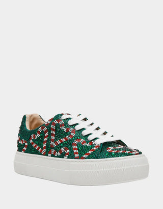 A low-top platform sneaker featuring a green base covered in red and white candy cane beading, with white laces and a thick white platform sole.