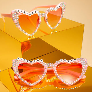 Heart-shaped sunglasses with 'Birthday Queen' text 