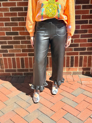 black pleather straight leg pants with ruffle on hem