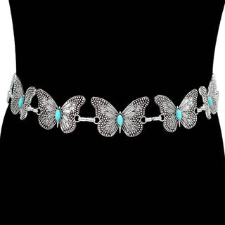 Butterfly-shaped belt with turquoise centers.