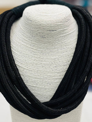 Black colored rope statement necklace.