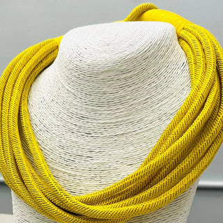 Yellow colored rope statement necklace.