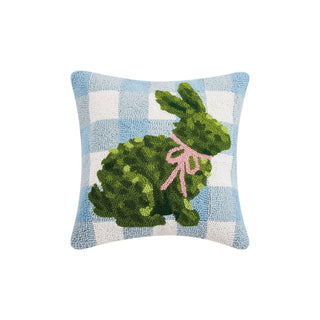Decorative pillow with a green bunny and pink bow on a blue and white checkered background