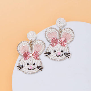 Beaded bunny earrings with pink bows.