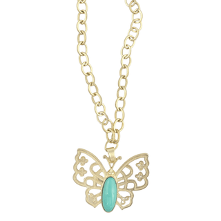 A gold butterfly pendant necklace with a turquoise-colored oval stone in the center.