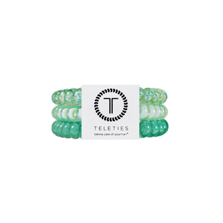 By the sea shore small hair ties.