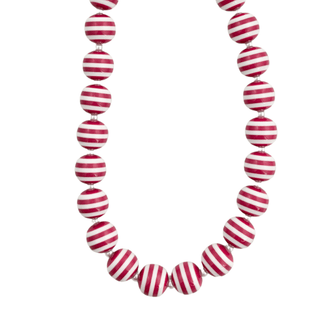 A candy cane colored beaded necklace made of glossy round beads with alternating red and white horizontal stripes. 