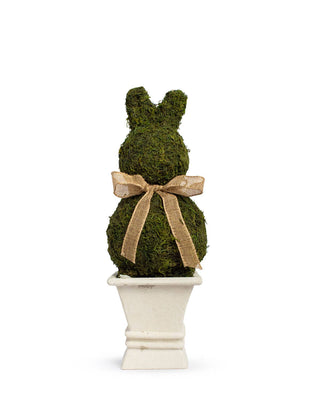 Moss-covered bunny figure with a bow in a white pot.