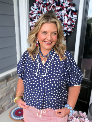 white and navy polka dot blouse