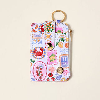 Colorful keychain pouch with various designs.