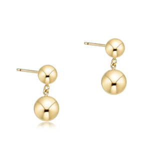 Gold ball drop earrings.
