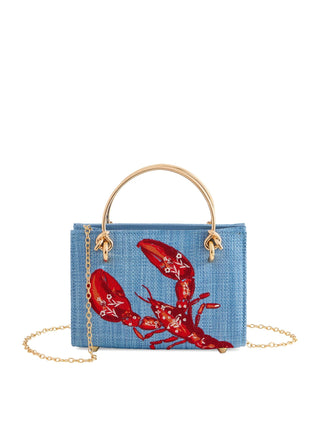 Blue straw handbag with a red lobster embroidered design.