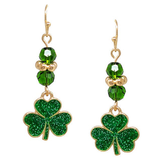Green shamrock earrings with gold accents.