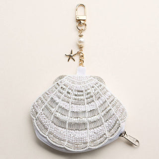 Beaded shell-shaped keychain pouch.