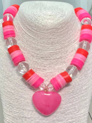 Necklace with pink and red beads and pink heart pendant