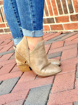 Corky tan ankle boot with white embroidery around trim with slit on side and back zipper