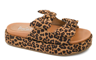 Leopard print sandal with a brown sole on a white background